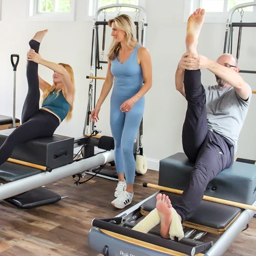 Pilates-Burlington-MA-Nicole-Burns-With-Clients-In-Tree-Pose